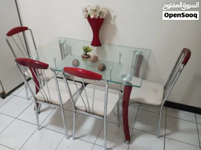 Glass-top dining table with 4 chairs (red legs, white seats) 3