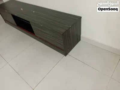 grey TV table stand moving storage and shelves طاولة تلفزيون رماديه بتخزين ورف 3
