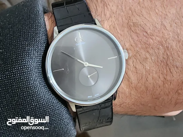 ساعة (Calvin Klein) أصلية  الشكل روعة جلد اسود اصلي صنعت  في السويس (Made in Swiss) كالجديدة