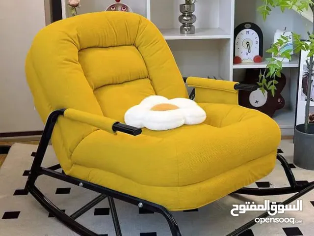 كنبة هزاز طبية مع مخدة لون اسود و اصفر