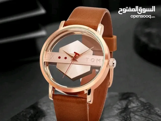 ساعه تومي الانيقه لون ذهبي