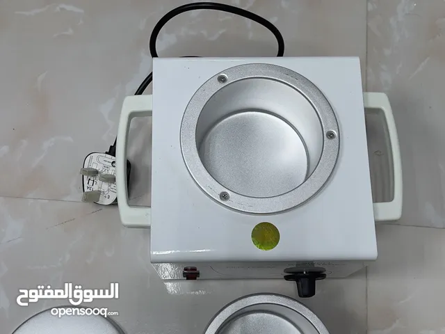 جهاز تسخين الحلاوة (wax heater)