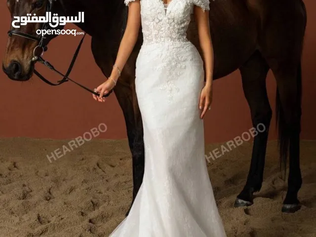 موسم الاعراس قرب فساتين زفاف و فساتين سهرة مميزة ملبوسة مرة واحدة بحالة جدا ممتازة للبيع