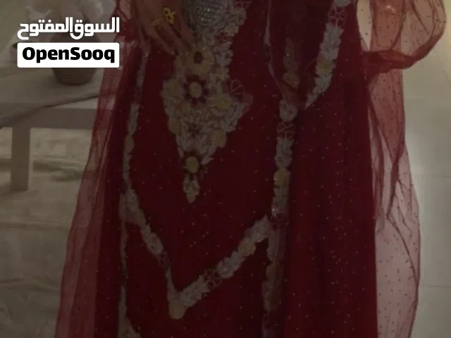 لبسه إمارتي خليجي تجننن لون احمر على عنابي