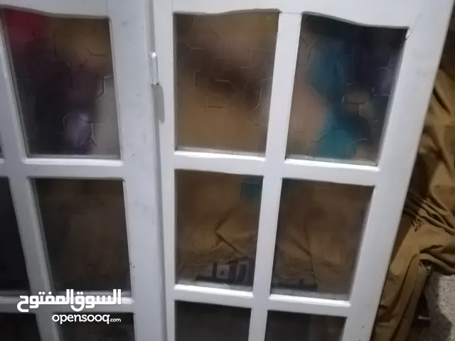ضلفتين شباك بالزجاج