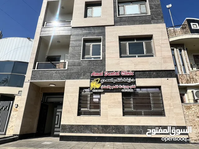بناية حديثة للبيع في الكرادة شارع العطار