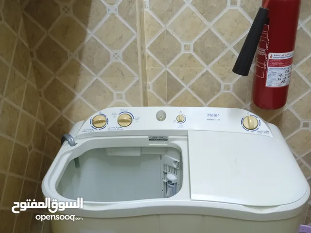غساله للبيع واصتوانة غاز وطاولة خشب وغاز على الكهرباء