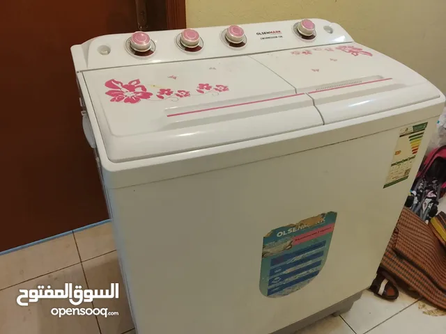 غسالة وسرير أطفال