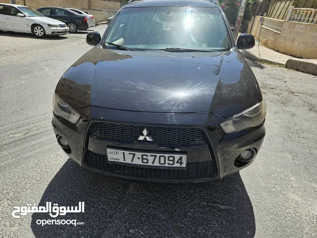السياره بالصلاة على النبي متسوبيشي أوت لاندر موديل 2012 فحص 2جيد خلفي قصة الفراشة جيب 7ركاب