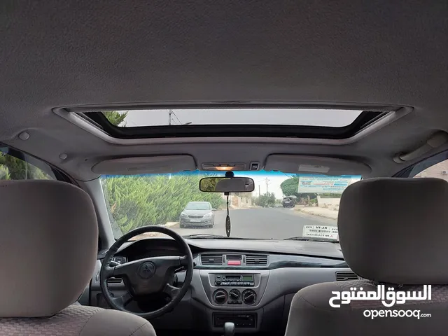 ميستوبشي لانسر محرك 1600اصلي فل مع فتحة جميع الضافات بحالة الشركة معنى الشركة