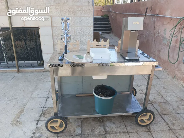 بسطة عصير مع عصارة يدوية