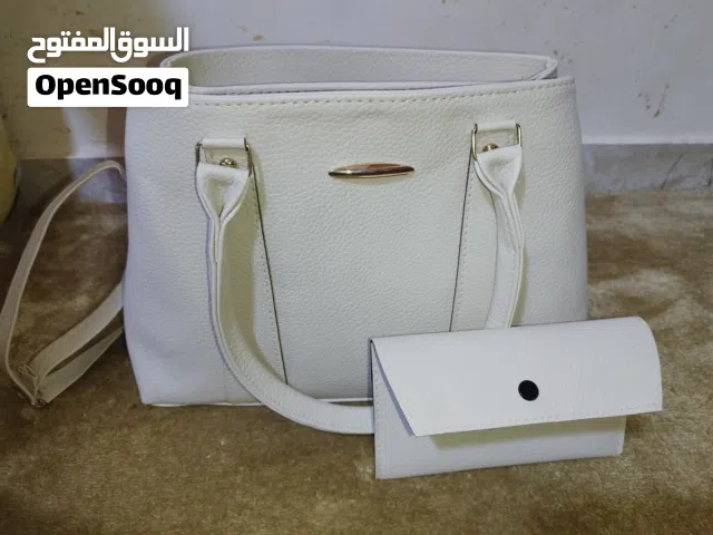 شنطة جديدة بيج فاتح  مع محفظة في اربد ب 10 دنانير