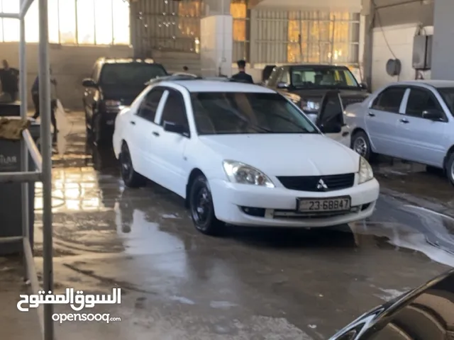لانسر 2012 ثلاث جيد دهان نظيف جداا و مكانيك توب نظافه