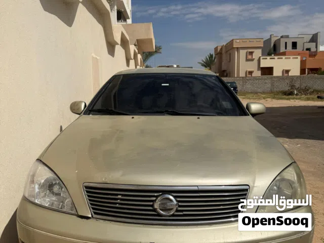 نيسان  موديل 2010 ماشية 200الف محرك المليون