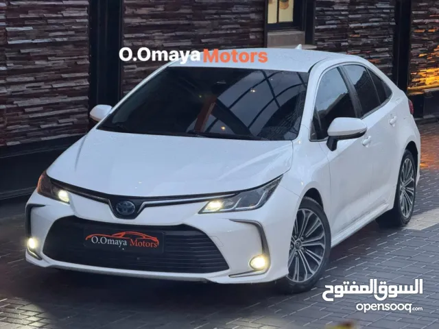 Toyota Corolla Hybrid 2023 عداد قليل ، فحص نخب ولا غرام بوية ، أعلى فئة إضافات و بسعرررررر مميزز
