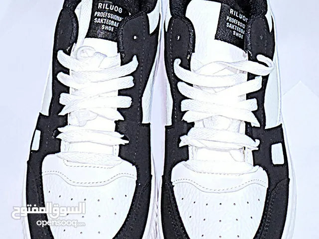 Black and white designer shoes size: 42 negotiable price FREE DELIVERY