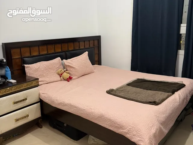 Wooden strong bed with mattress and side table with 2 pillow 500AED