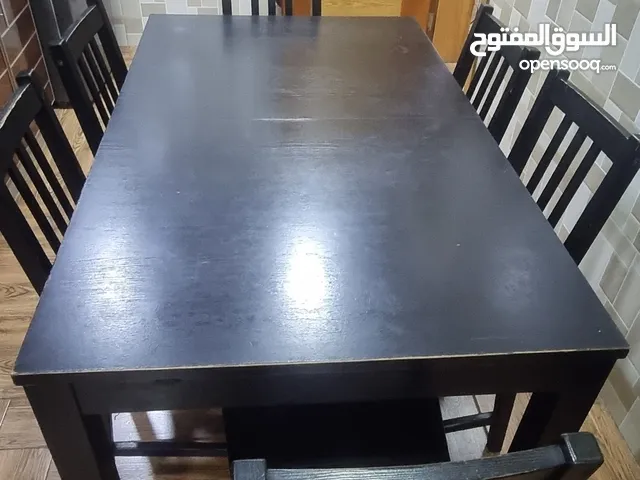 Dinnig table with 6 chairs.. biught from ikea.. strong and solid..extendable type table
