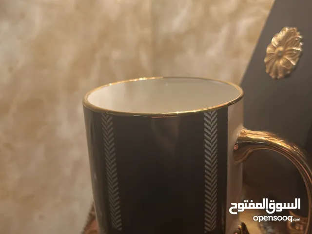 كوب (مج) اخضر الون يده ذهبية وجميل جدا ثقيل الحجم