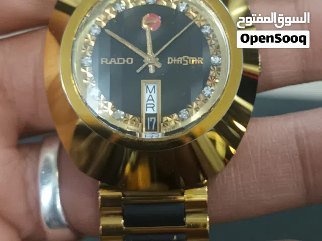 رادو رجالي تومتيك اسود وذهبي