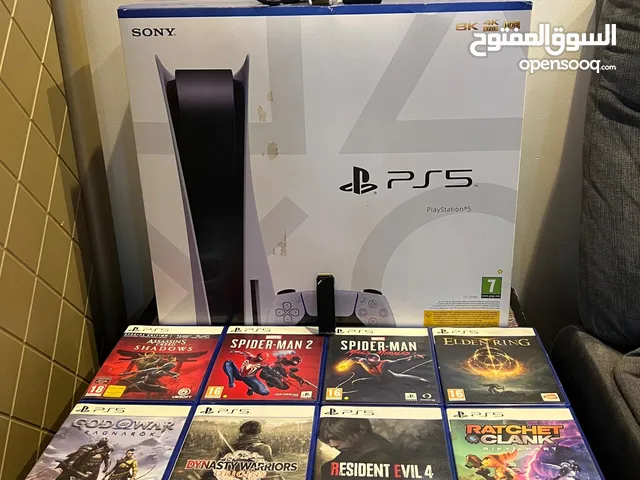 للبيع جهاز بلايستيشن PS5 مع العاب مع قاعدة شحن اليدات مع ذاكرة 2 تيرا