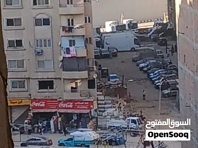 شقة للبيع بالمطبعة فيصل محور عمر ابن العاص عند نزلة حى الهرم وميدان الساعة  ببرج واسانسير