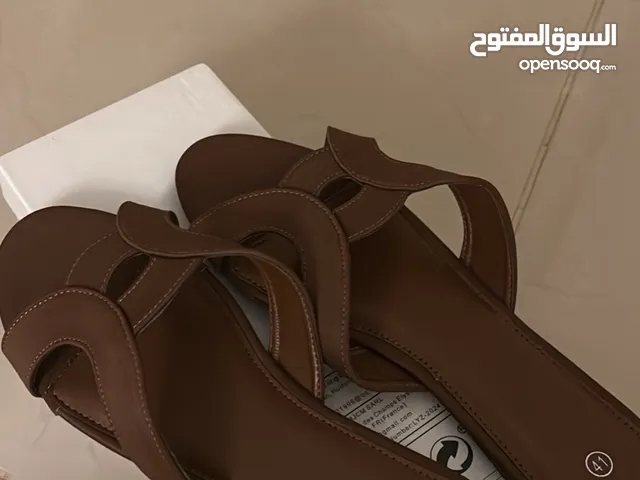 Brown women’s flats