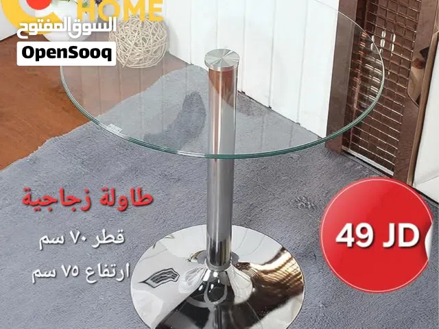طاوله زجاجيه راقيه بقاعده كروم