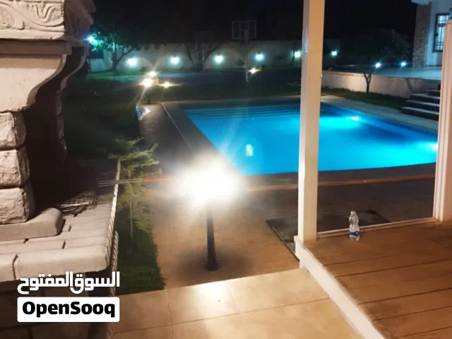 استراحه . 5000 م . ايجار يومى ب 700 دينار . تاجوراء . مزرعة اللوز.