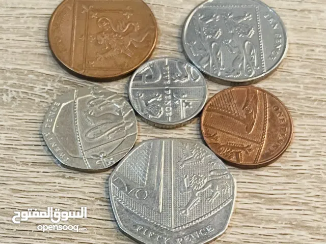 طقم عملات الملكة اليزابيث الثانية ( يشمل الدرع الملكي من الجهة الخلفية