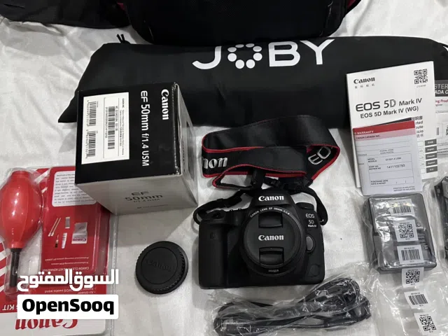 كاميرة كانون d5 مارك 4 مع عدسة 50 f/1.4 وترايبود امريكي وكل مافي الصورة