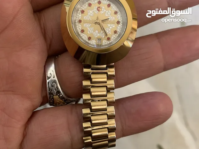 ساعة رادو نسائي ذهبي اوتوماتيك كبس ضد الماء وتعمل بدقة عالية