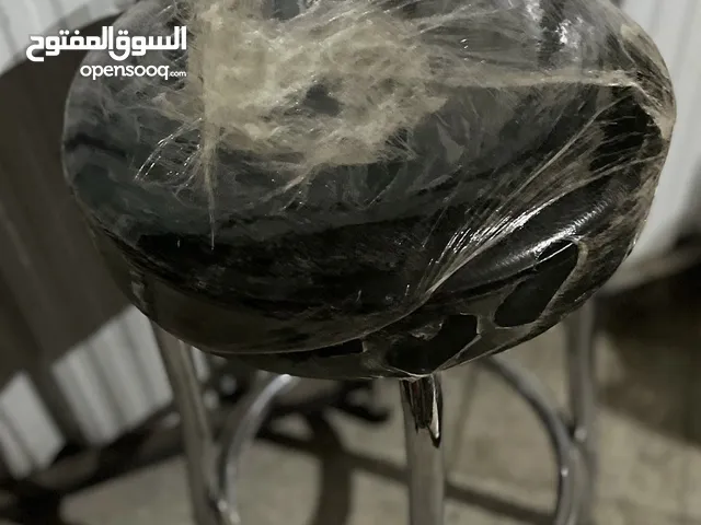 كرسي جلد مرتفع بدون مسند