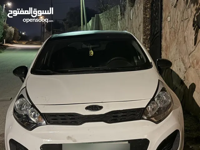 كيا ريو 2012 تأمين شامل سنة كاملة  السيارة نظيفة ماطور جير الالف الالف لون ابيض مع سقف اسود اندماج