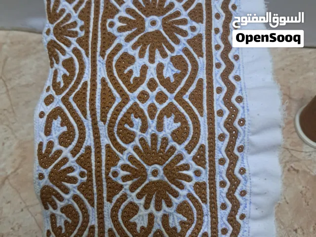 خياطة الكمة العمانيه