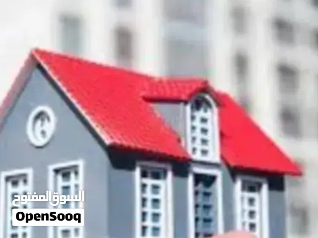 بيت طابقين مع محل تجاري