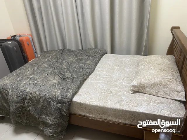 Wooden bed with its mattress  سرير خشب مع مرتبه