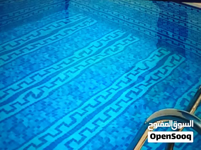 فيلا ارضيه علي واجهتين بحوض السباحه عين زارة الحاراتي
