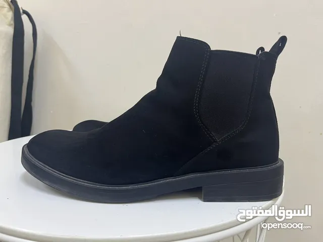 Black Boots in Muscat