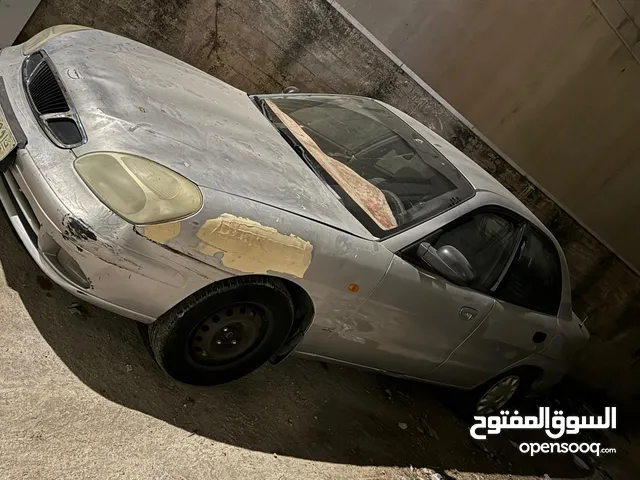 دايو نوبيرا موديل 2000 ماتور 1600 يد أولى لون فضي ماتور وجير بحالة ممتازه
