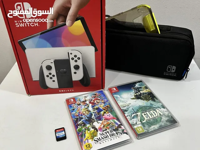 Nintendo Switch OLED with 3 games carrying case protective case and handheld grips!