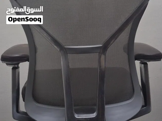 Allsteel Acuity task chair with a dark brown leather seat and mesh back