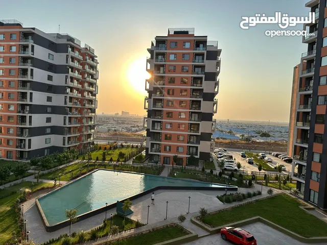 شقة في مشروع عائلي بسعر مناسب للبیع غرفه و صاله ب اطلاله جمیله و منظر خلاب