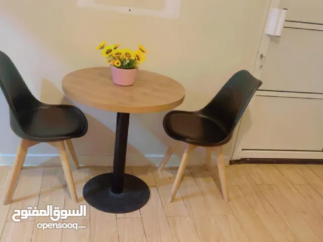 2 chairs with table