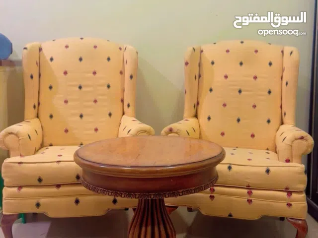 Two armchairs with table for sale .