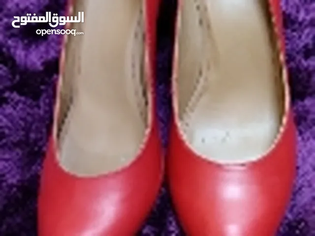 Red With Heels in Muharraq