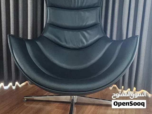 Black leather cocoon swivel chair