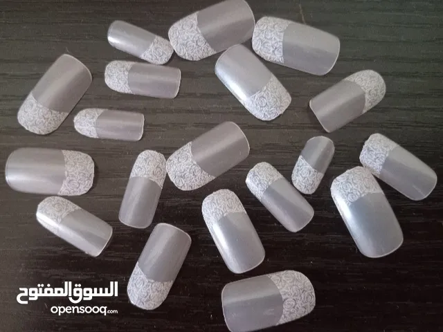 New set of pale pink/white artificial nails with rose design in excellent condition