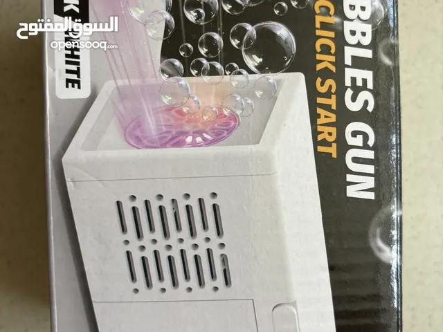 Hand held bubble machine