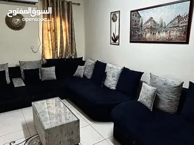 كنب و طاولة للبيع living room couches and table for sale with the curtains